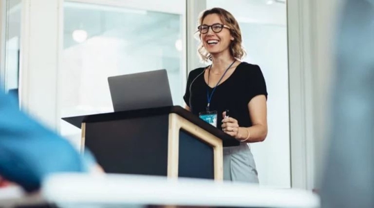 A woman is presenting her report