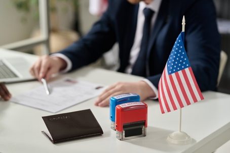 immigration officer sitting at his desk