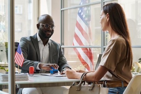 Woman getting visa documents in office