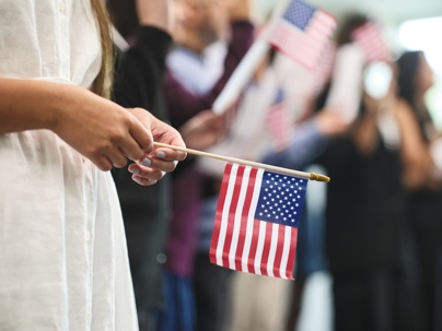 woman holding American flag